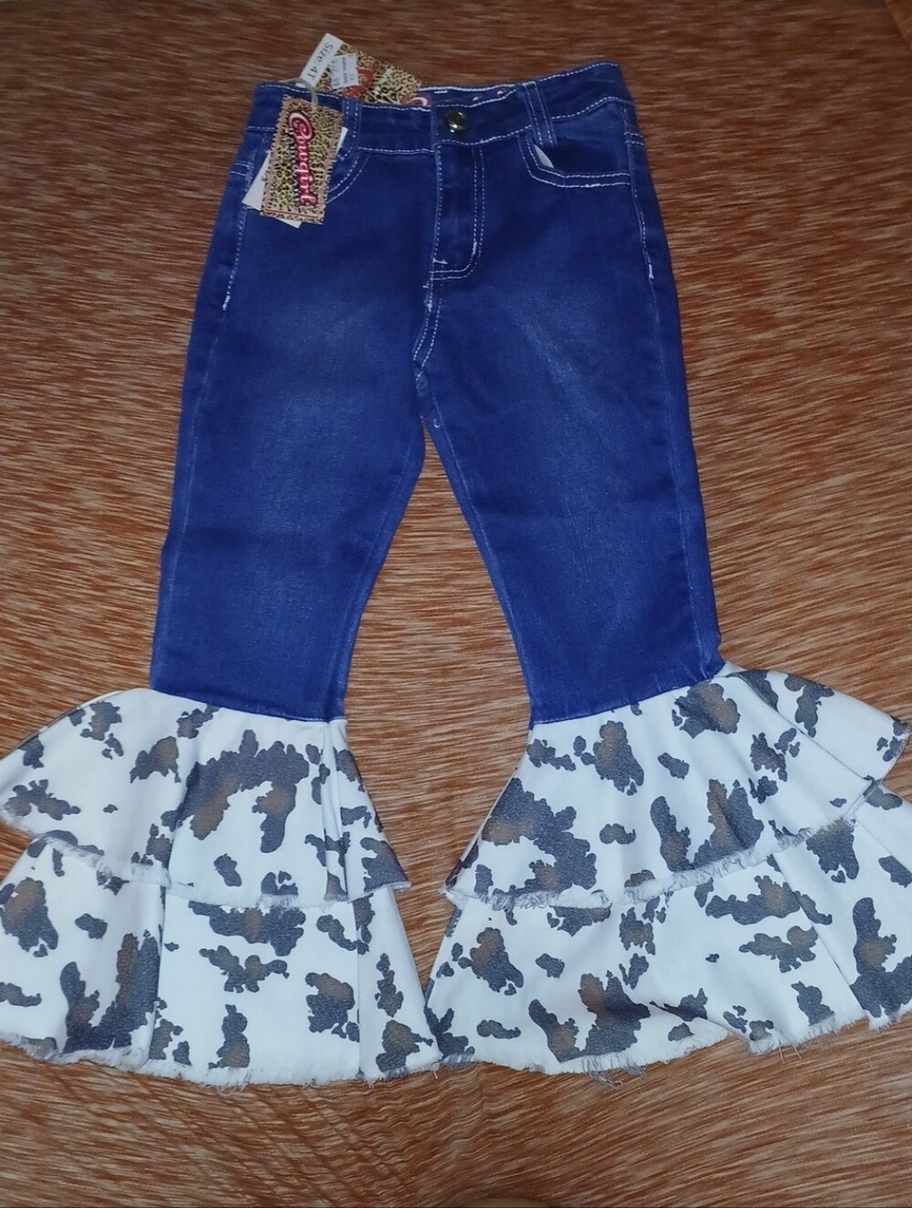 Girls Blue Denim Flare Jeans with White & Brown Cowprint Ruffle Hem by Cowgirl H